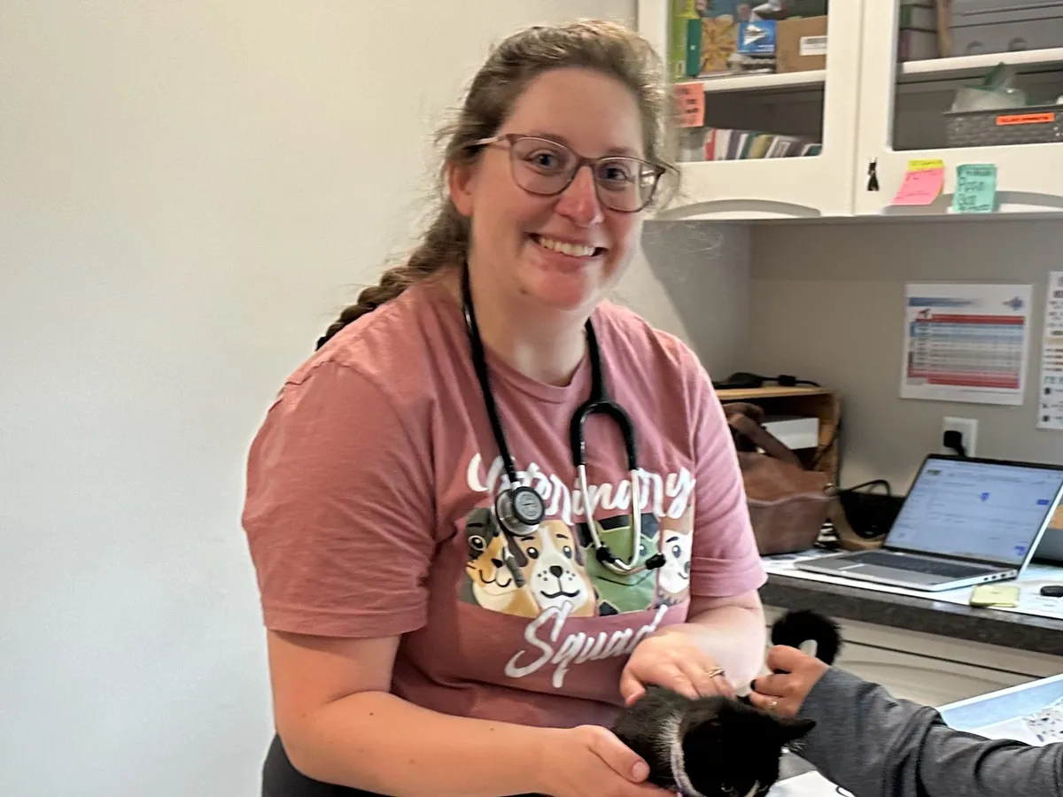 Dr. Caity Walsh with a cat patient at Happy Paws & Claws in Englewood, OH