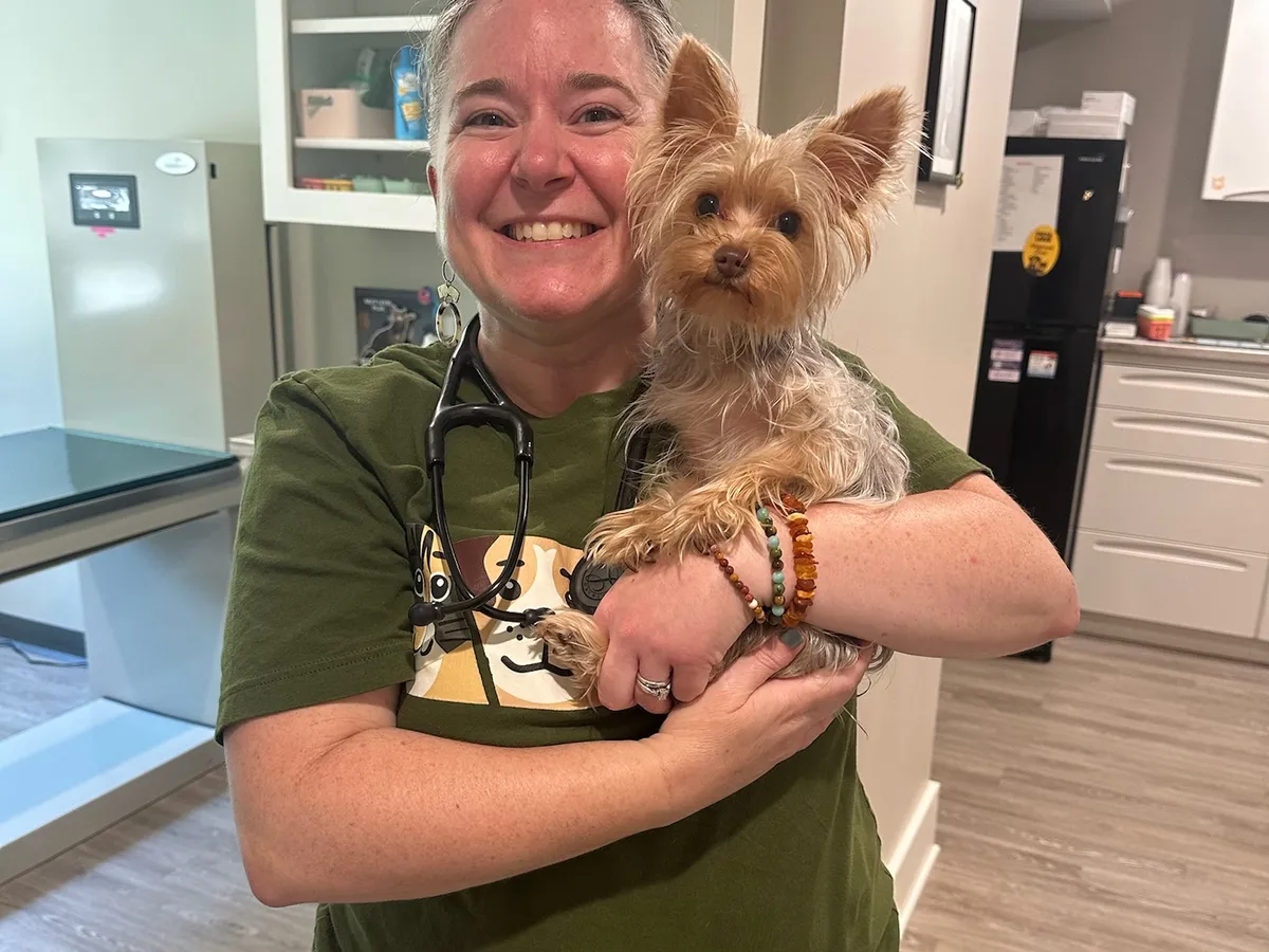 Dr. Angela Melton holding a Yorkshire terrier